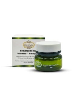 Un pot vert de Belle Nubian Glycolic Acid Face Cream est placé devant sa boîte d'emballage blanche et verte.