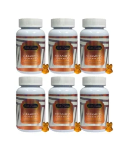 Combo 6x NEW VITAMIN C GUMMIES - L'Activateur de Teint Haute Performance, chacun avec un bouchon blanc et une étiquette orange, parfait pour votre routine de teint haute performance.